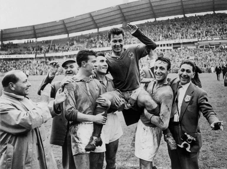 French forward Just Fontaine is carried off the field by his teammates (from L) Yvon Douis, Andre Lerond and Jean Vincent after scoring four goals against West Germany 28 June 1958 in Göteborg during the Soccer World Cup match for 3rd place. France beat West Germany 6-3 with the help of Fontaine, wh
